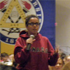 A student asks a question during the Q & A